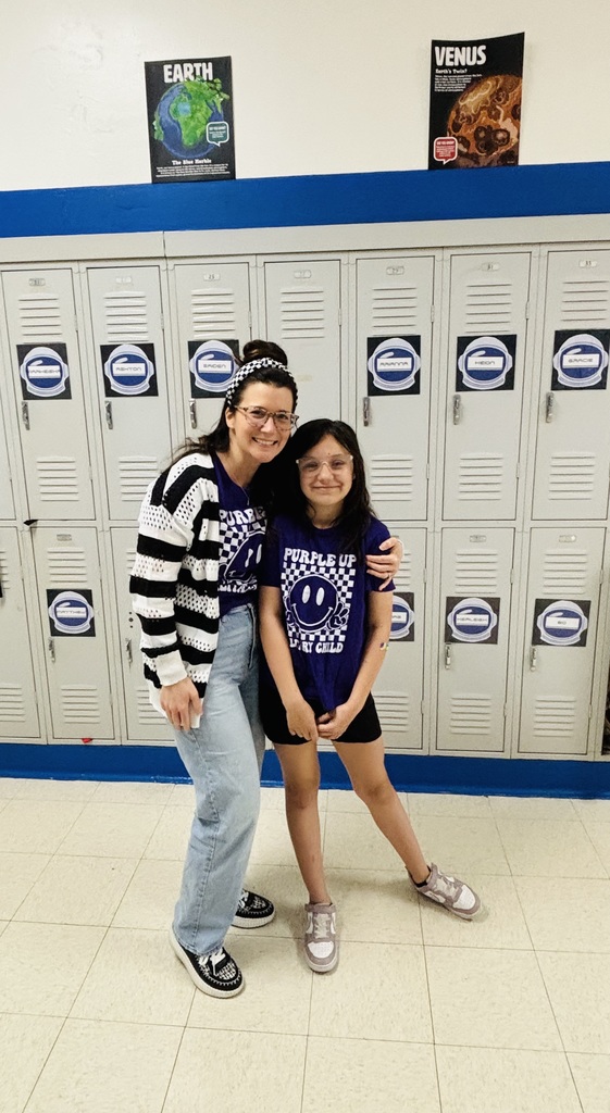 Straley staff and students wearing purple for Purple Up Day-showing support for our military students and their families.