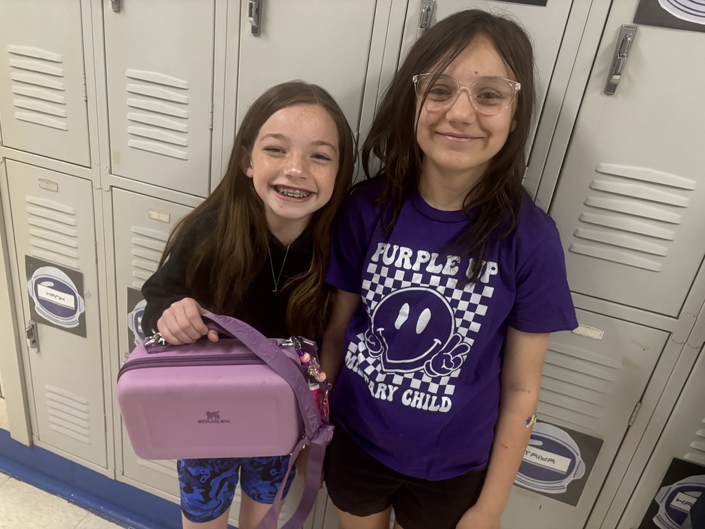 Straley staff and students wearing purple for Purple Up Day-showing support for our military students and their families.