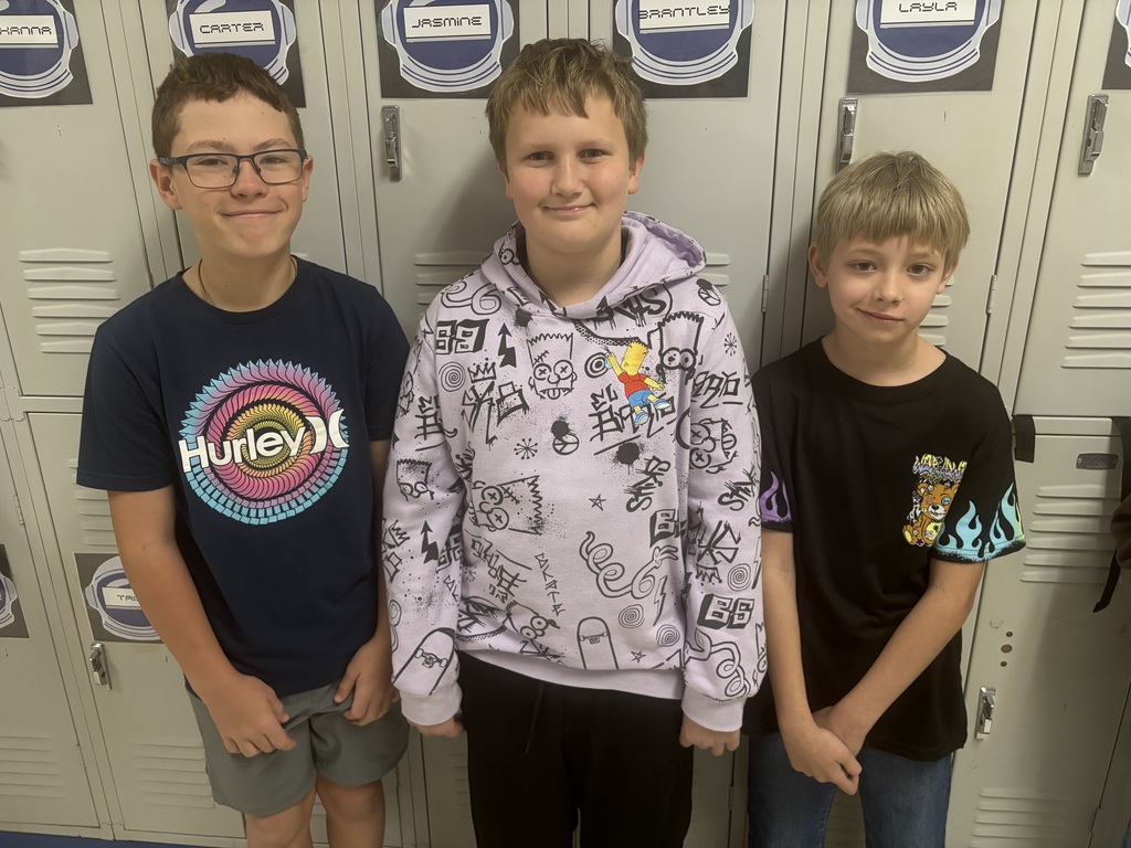 Straley staff and students wearing purple for Purple Up Day-showing support for our military students and their families.