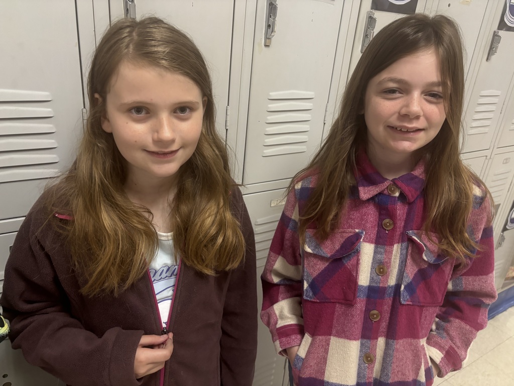 Straley staff and students wearing purple for Purple Up Day-showing support for our military students and their families.