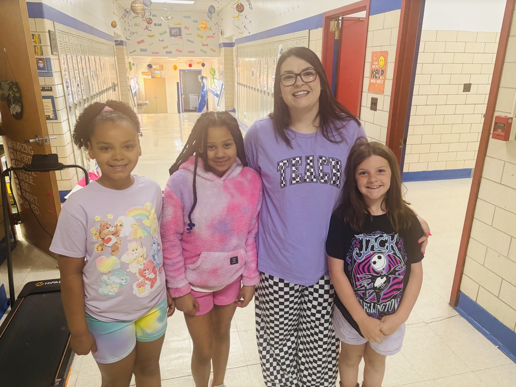 Straley staff and students wearing purple for Purple Up Day-showing support for our military students and their families.