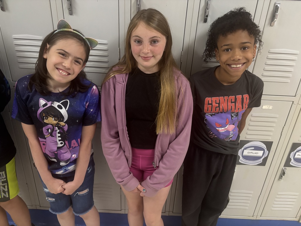 Straley staff and students wearing purple for Purple Up Day-showing support for our military students and their families.