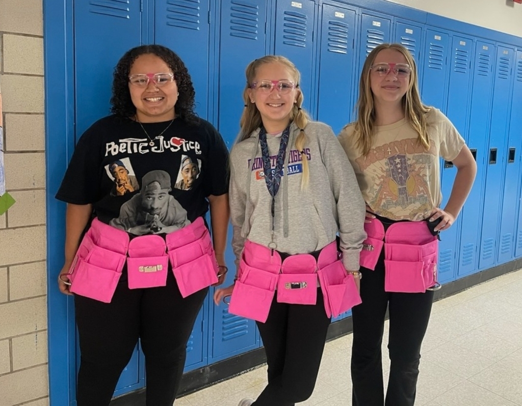 girls wearing work belts