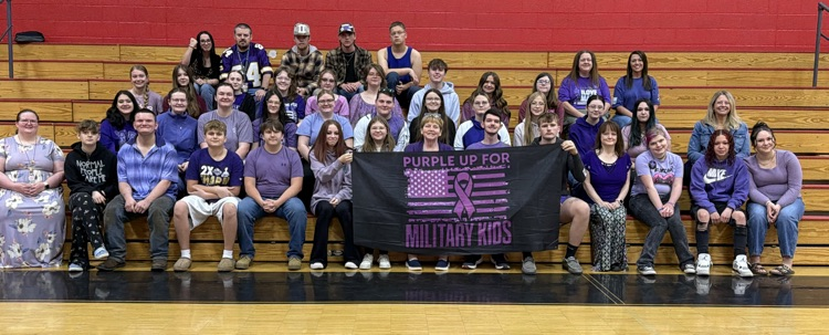 students and staff in purple to celebrate military connected families