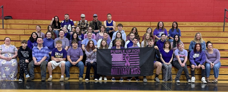 group of staff and students wearing purple for purple up day