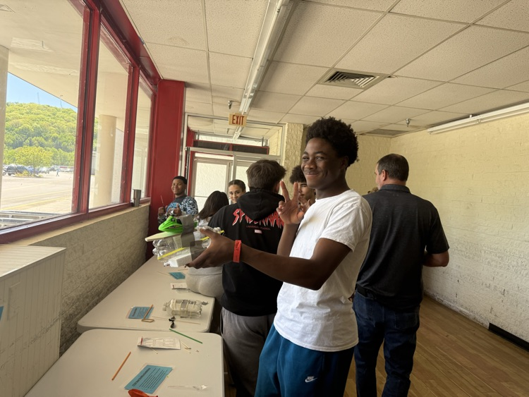GEARUP Stem day at Mercer Mall. students engaged in STEM activities at multiple stations  