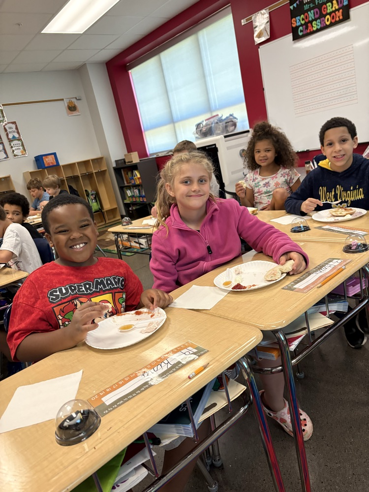 Second graders in Mrs. Fulp's class got to say "Cream cheese!" for these pictures. This week they have been reading, "Where on Earth is my Bagel?" They got to eat bagels with different toppings while listening to the story today! 