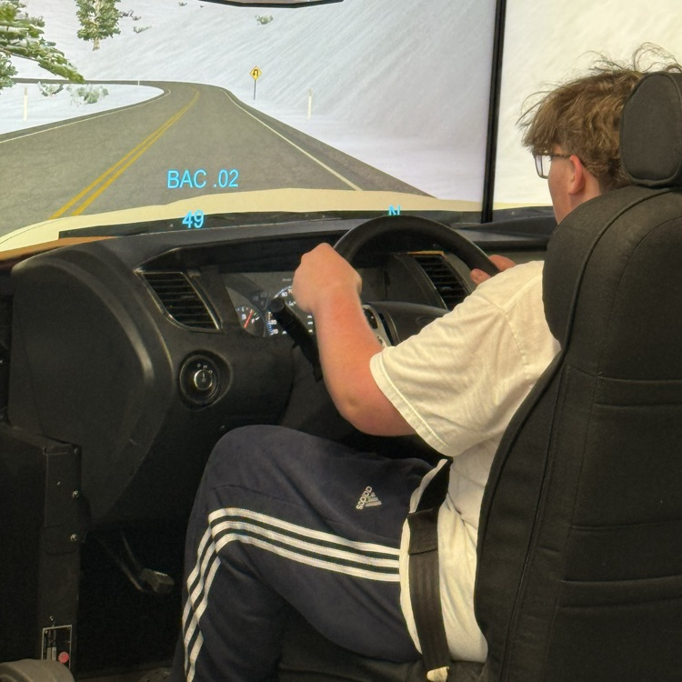 a BHS student behind the wheel of the DUI simulator