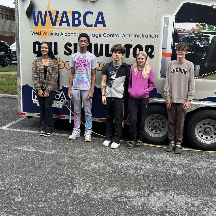 more BHS students standing in front of the DUI simulator trailer