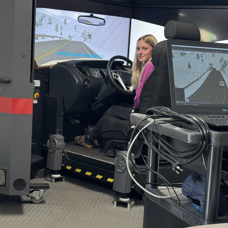 a BHS female student behind the wheel of the DUI simulator