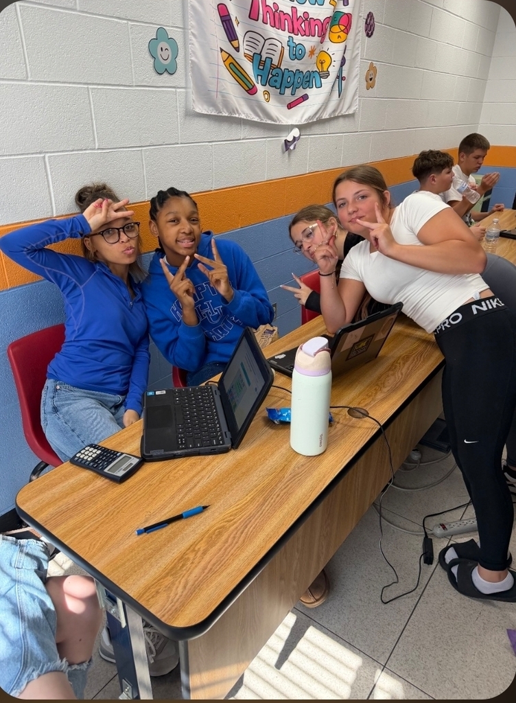 Students showing off their work