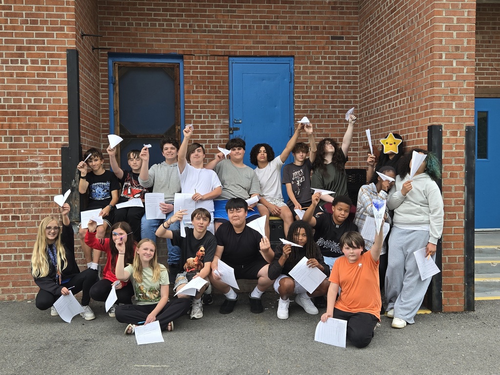 Students with paper airplanes