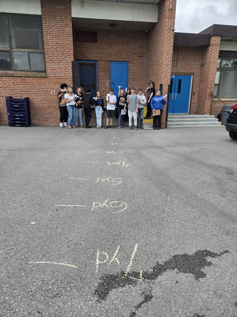 Students with paper airplanes