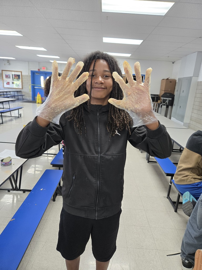 Showing his messy hands