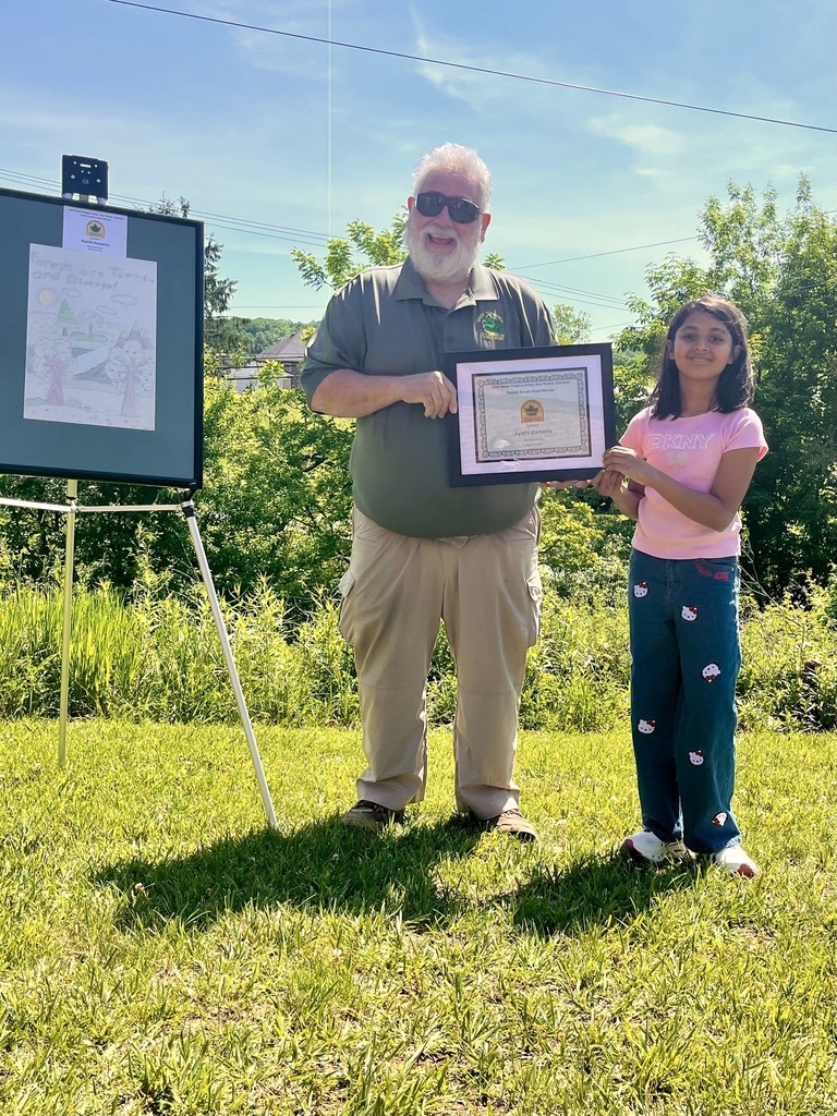 Glenwood student, Ayathi Kanjerla receiving the Arbor Day poster contest award from Mr. Andy Sheetz from the WV Division of Forestry