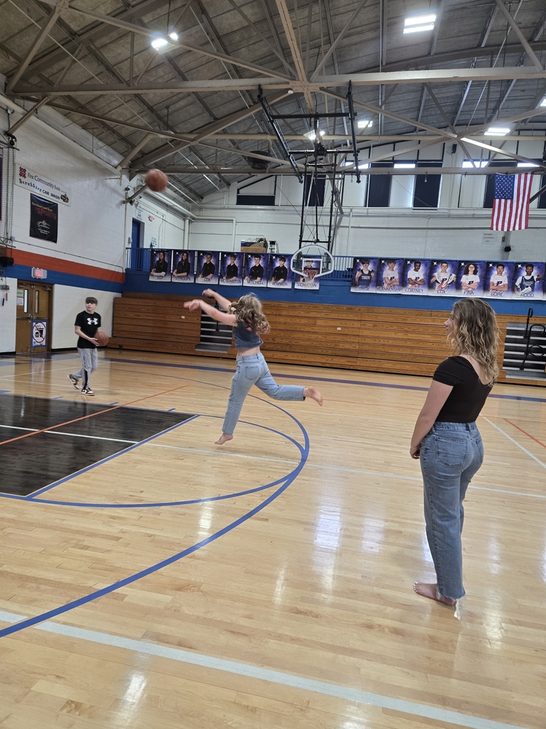 students playing basketball