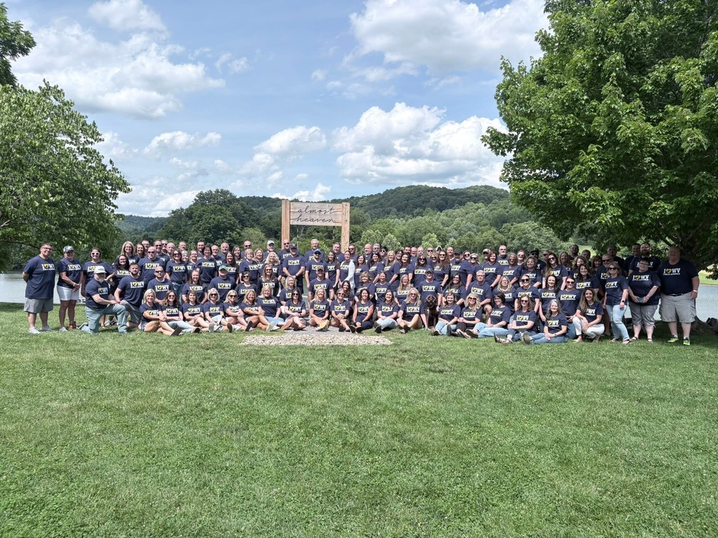 A group of people in blue shirts 