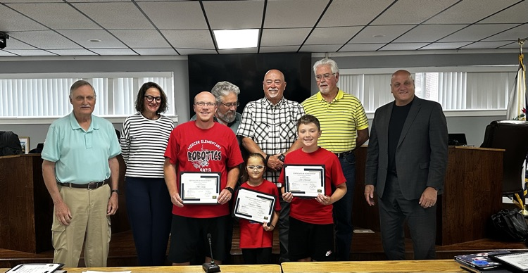 people being recognized by the school board