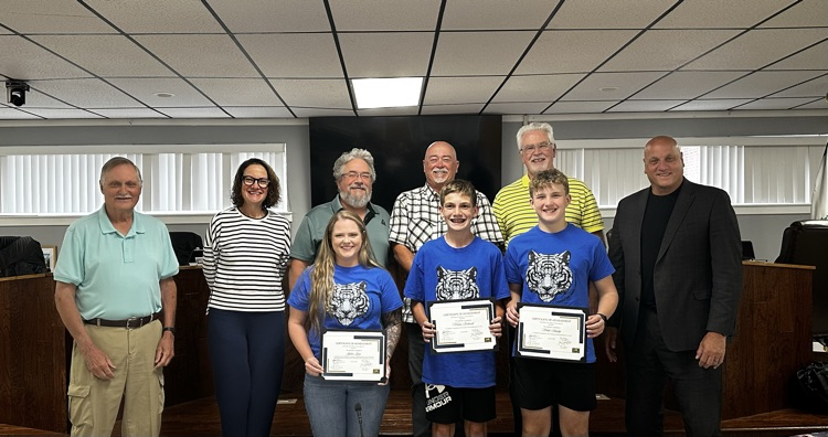 people being recognized by the school board