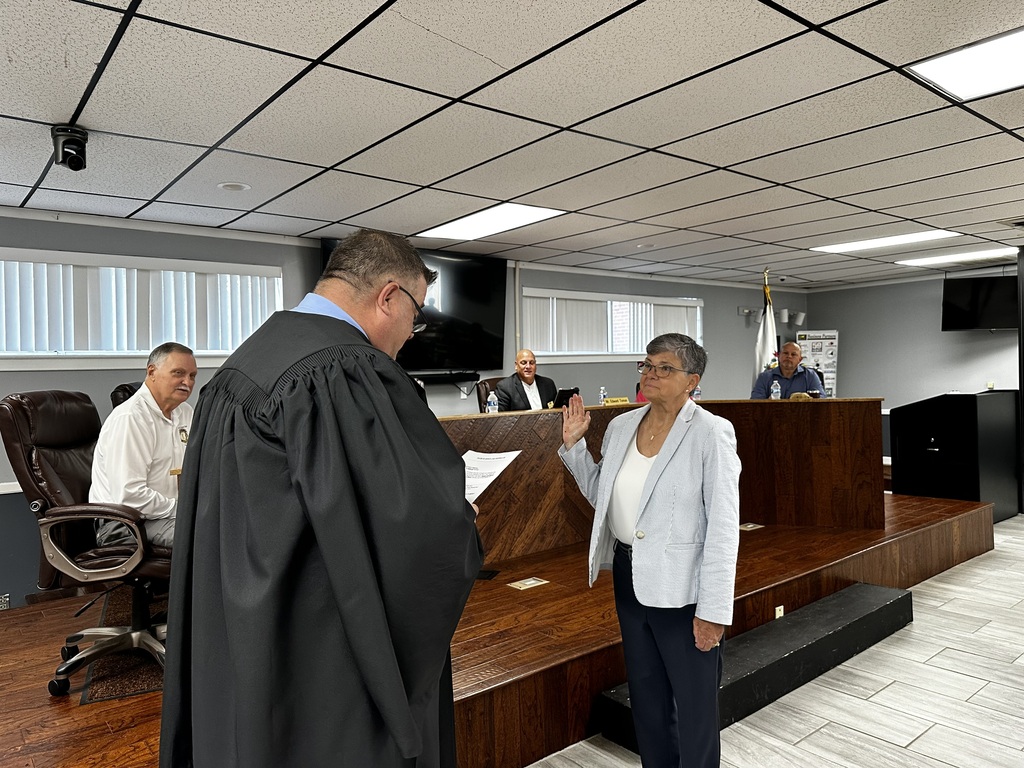 Dr. Deborah Akers being sworn in