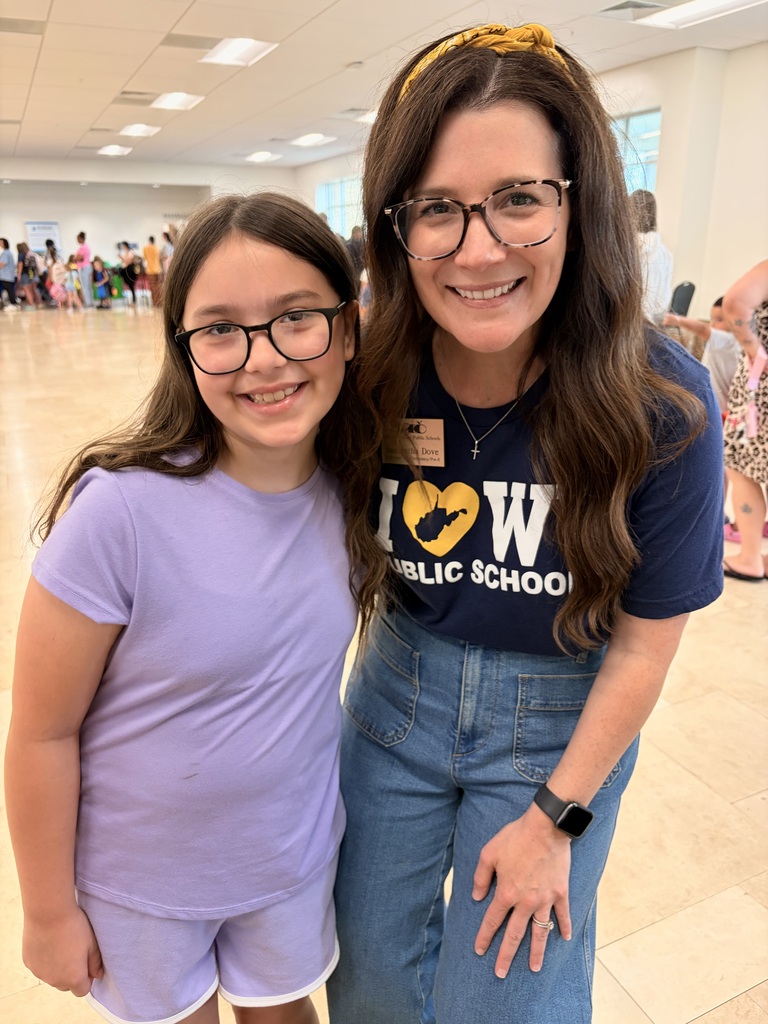 A smiling teacher and student