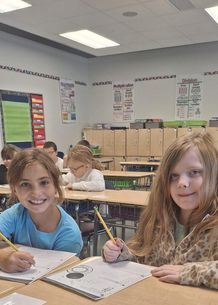 Two minds are better than one! Students in Mrs. Neal's 3rd grade class love working with a buddy.