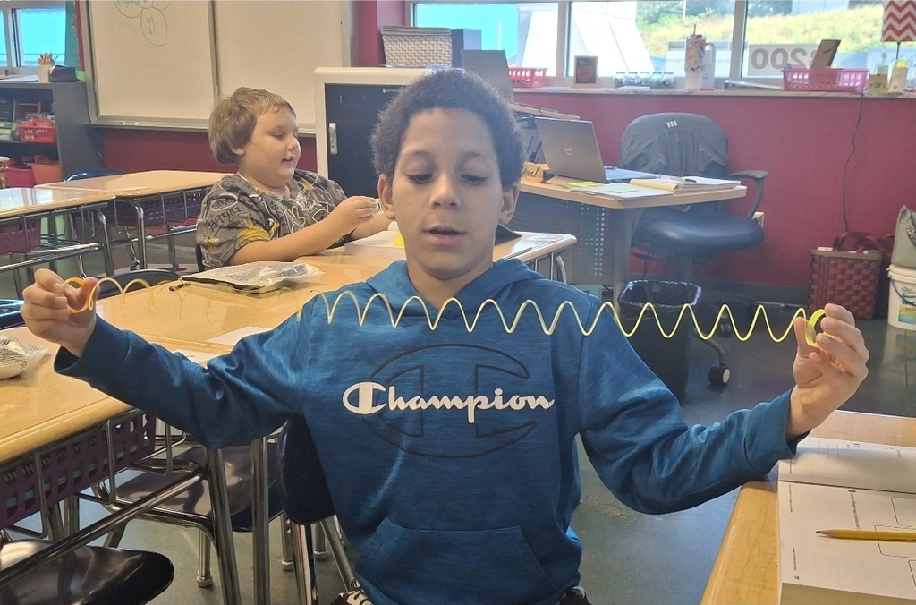 Students in Ms. Thornton's 3rd grade class are using Slinkies to practice breaking apart 3-digit numbers. What a fun way to learn about expanded form!