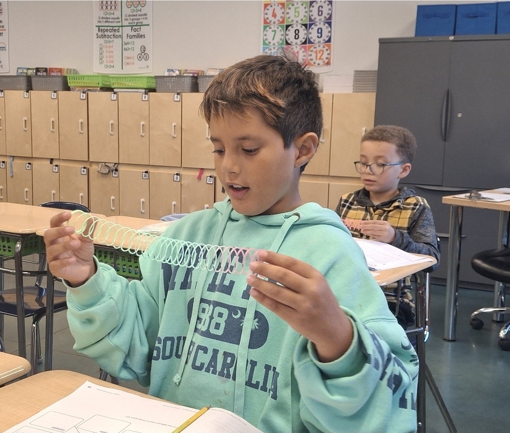 Students in Ms. Thornton's 3rd grade class are using Slinkies to practice breaking apart 3-digit numbers. What a fun way to learn about expanded form!