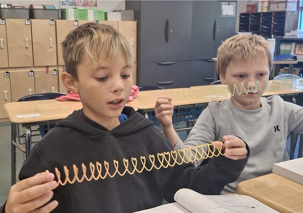Students in Ms. Thornton's 3rd grade class are using Slinkies to practice breaking apart 3-digit numbers. What a fun way to learn about expanded form!