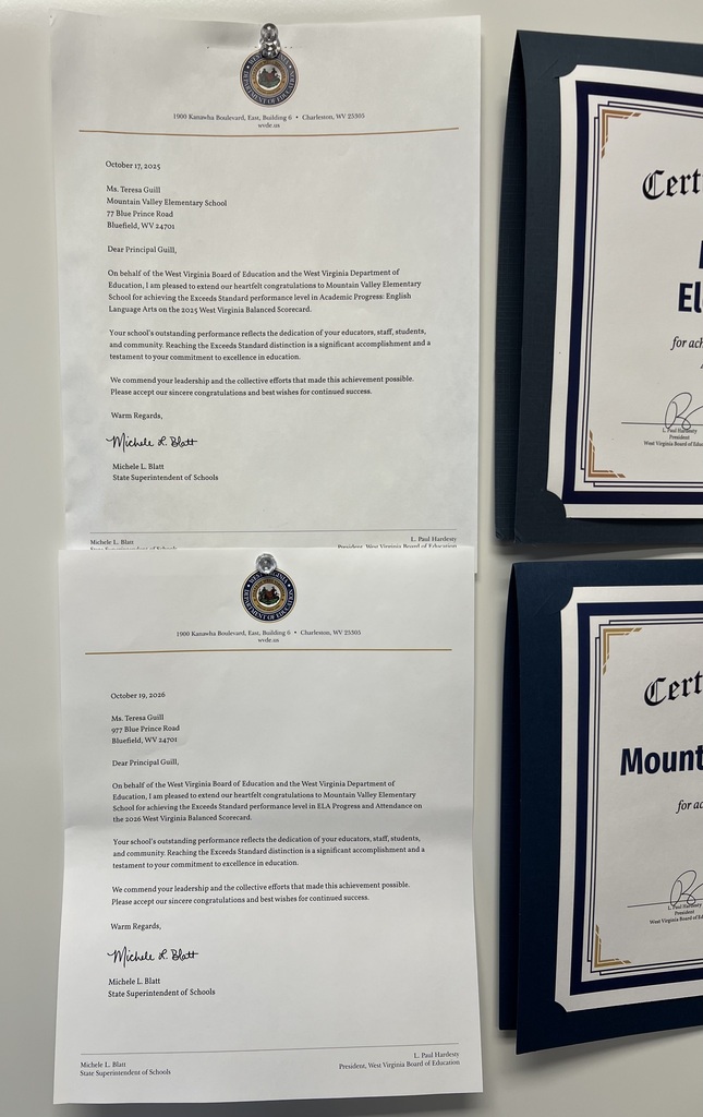 Three framed certificates on a wall, one white, one gold, and one navy blue, with gold borders and a logo on the top left.