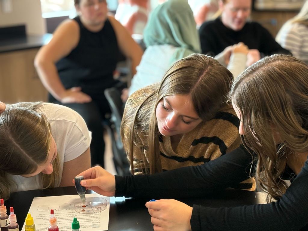 MECHS students identifying blood types.