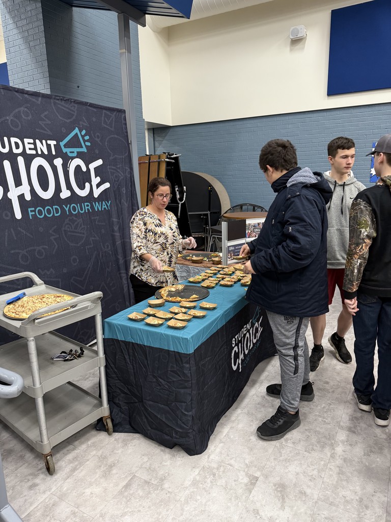 Students visiting the student choice line at the MECHS cafeteria to select their favorite pizza to be added to the menu next month. 