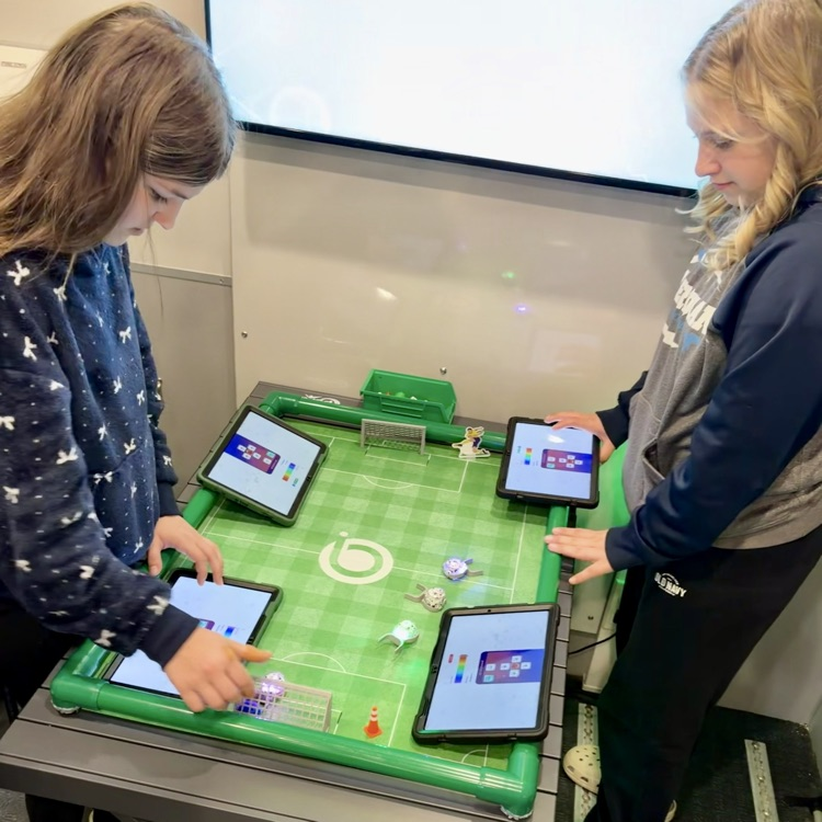 Stufents playing robot soccer