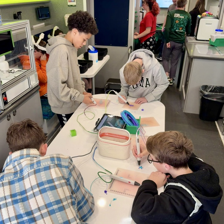 students working on activities on the STEM explorer. 