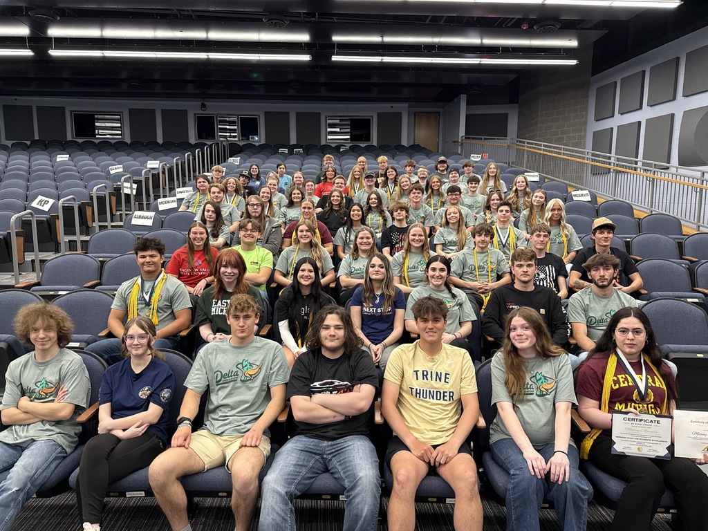 Students sitting in an auditorium posing for a photo for Decision Day 2026 at Meridian Early College High School