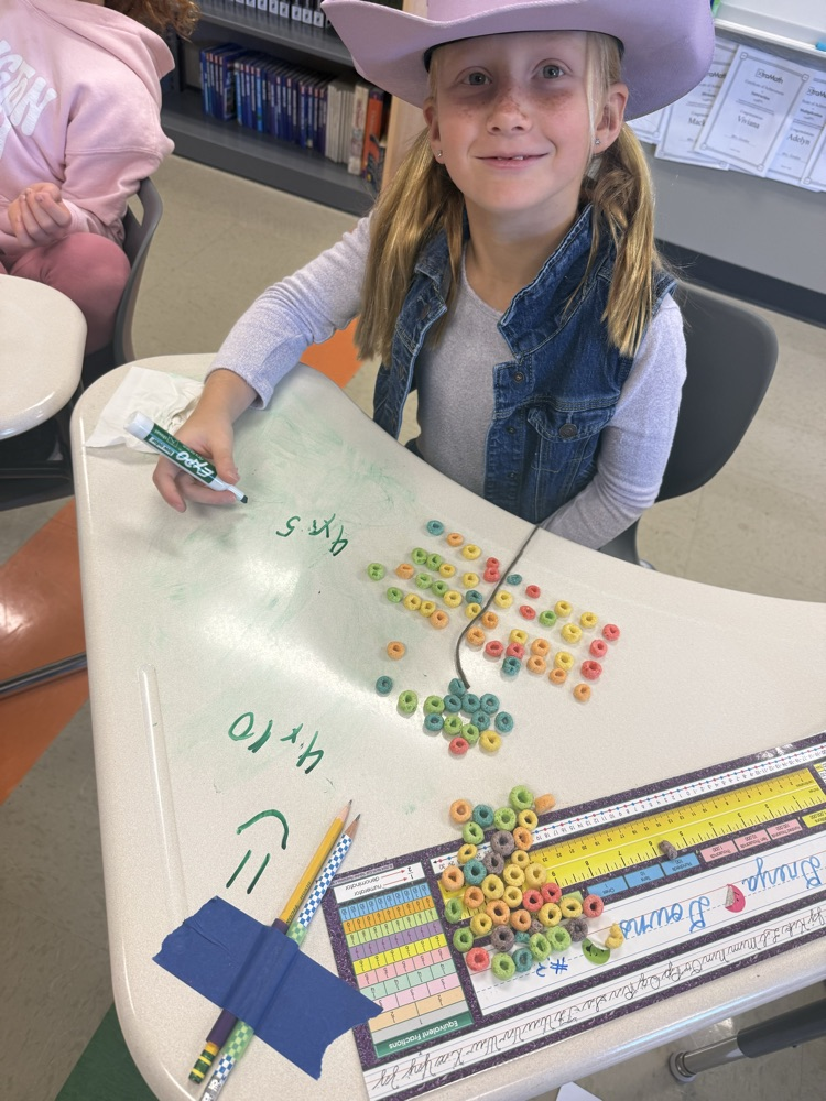 3rd graders are learning about the distributive property of multiplication by making fruit loop arrays!