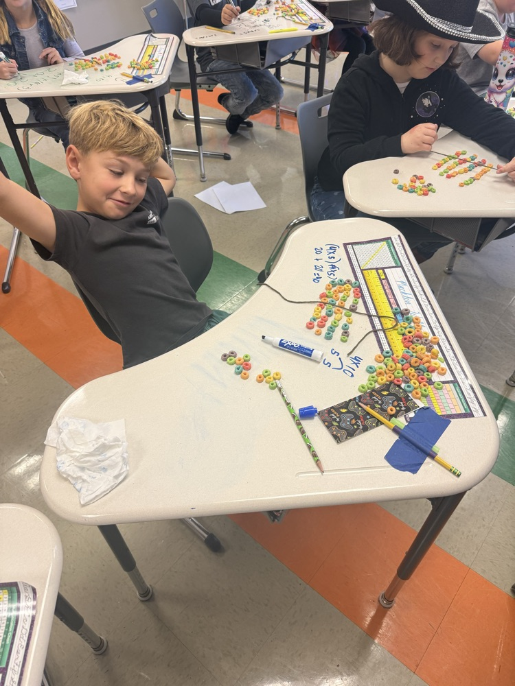 3rd graders are learning about the distributive property of multiplication by making fruit loop arrays!