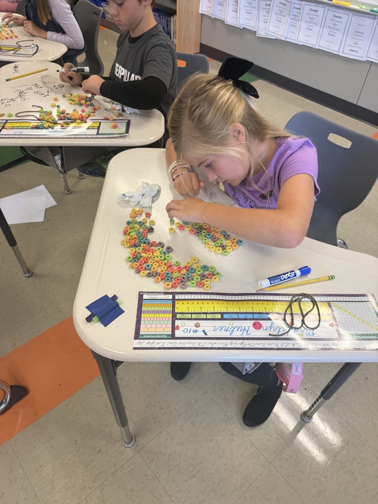 3rd graders are learning about the distributive property of multiplication by making fruit loop arrays!
