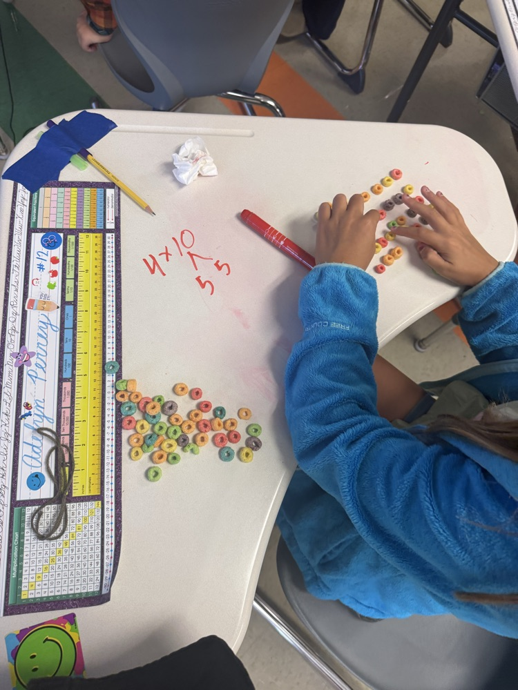 3rd graders are learning about the distributive property of multiplication by making fruit loop arrays!