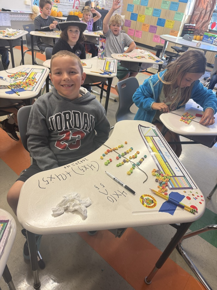 3rd graders are learning about the distributive property of multiplication by making fruit loop arrays!