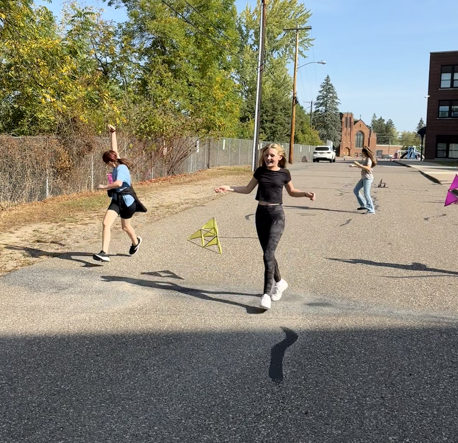 Three kids in PRMS parking lot STEAM Class