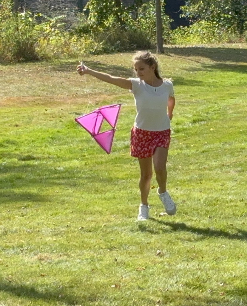 Student at PRMS holding kite for STEAM class