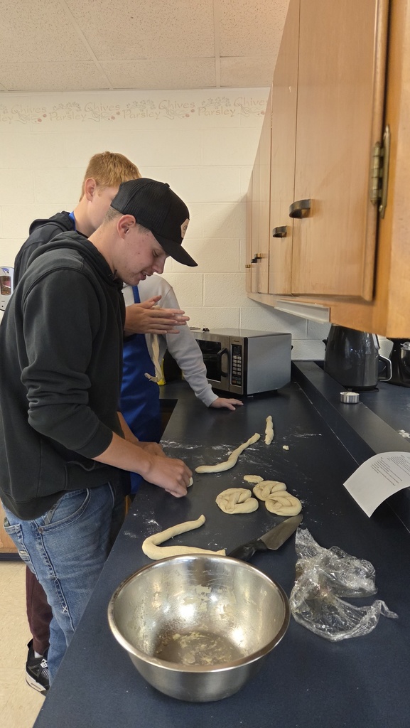 Two students making pretzels