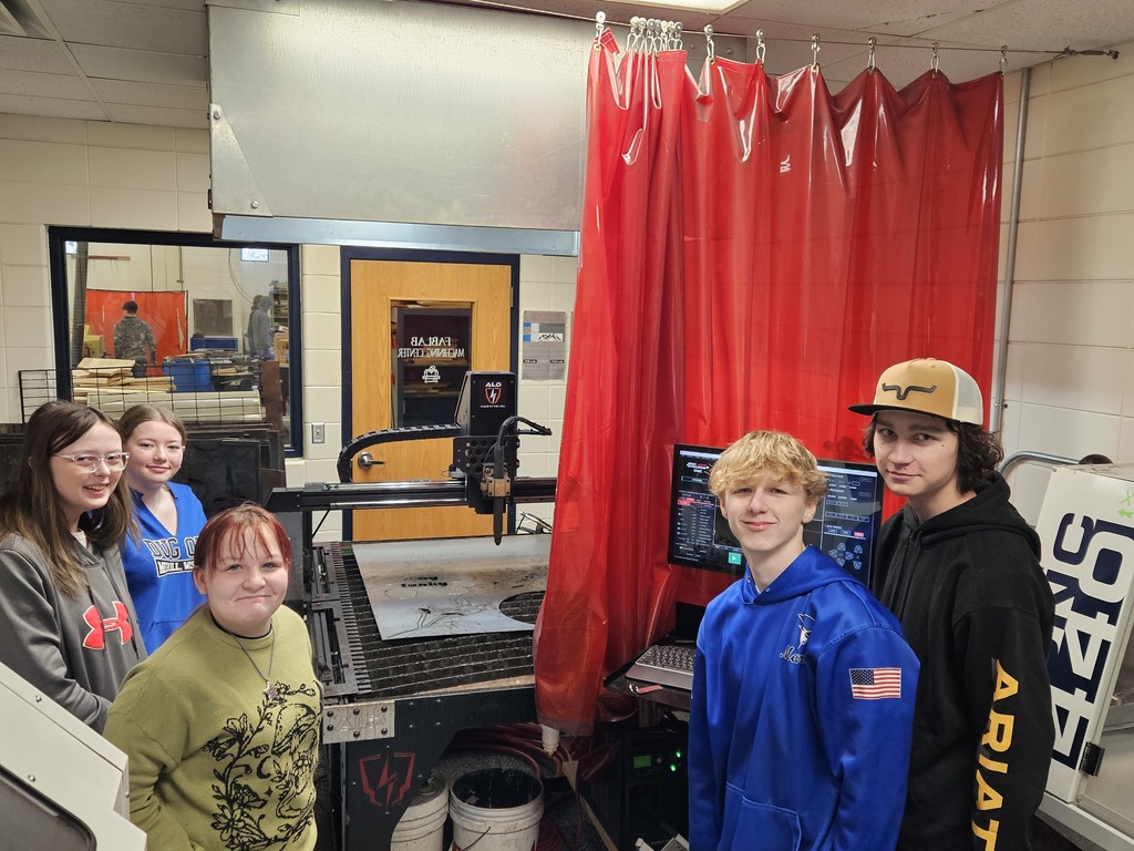 5 students posing for the camera in the FAB Lab
