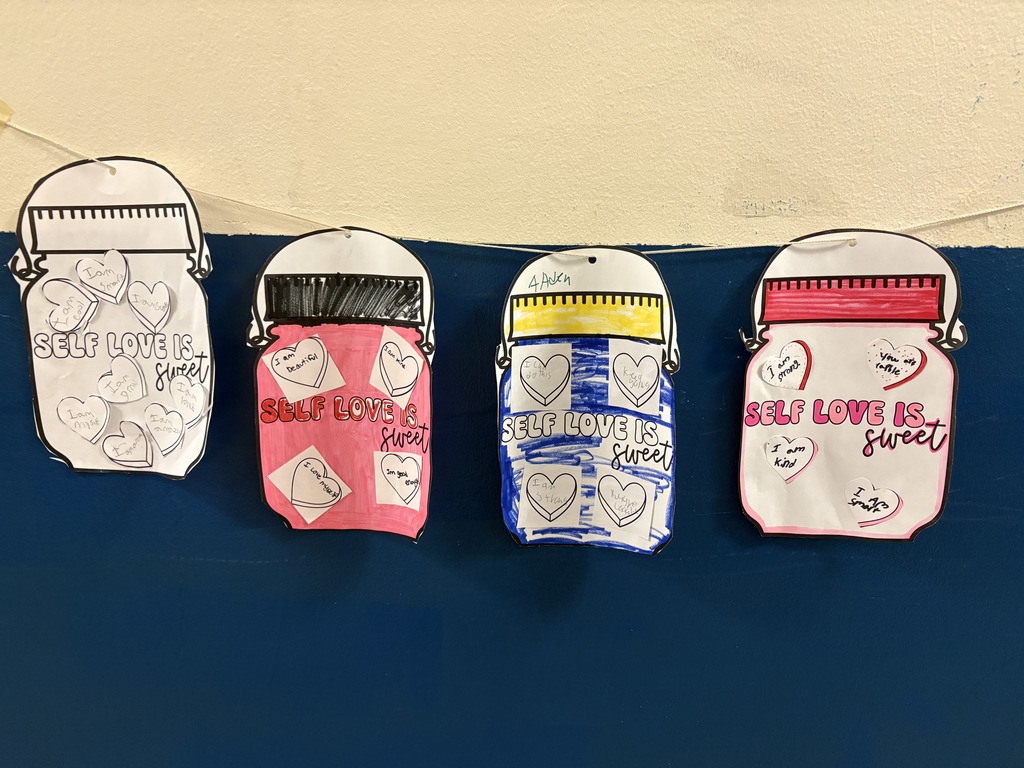 Self Love Is...jar notes hanging on a wall