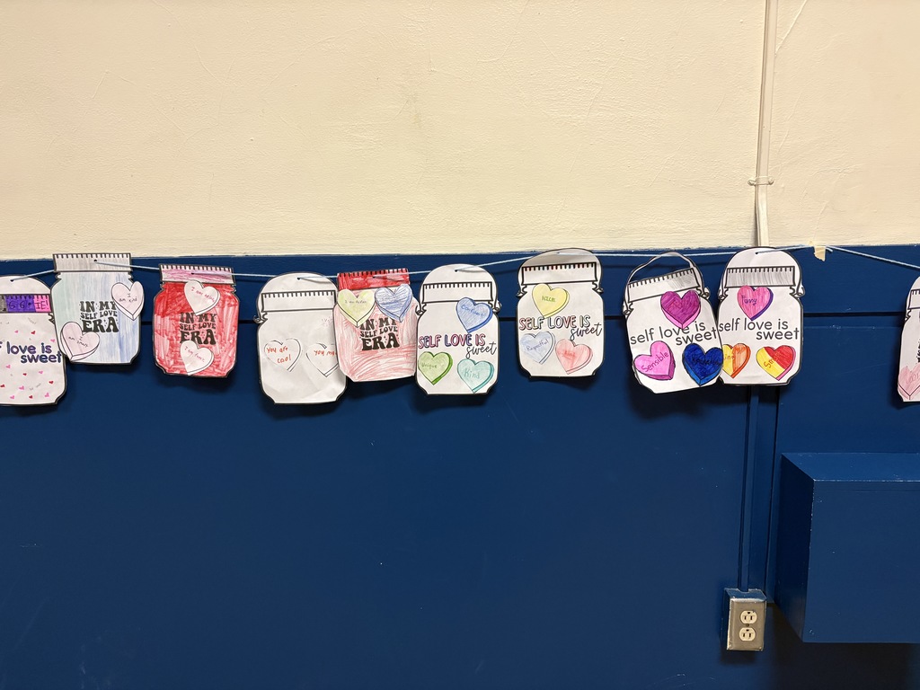 Self Love Is...jar notes hanging on a wall