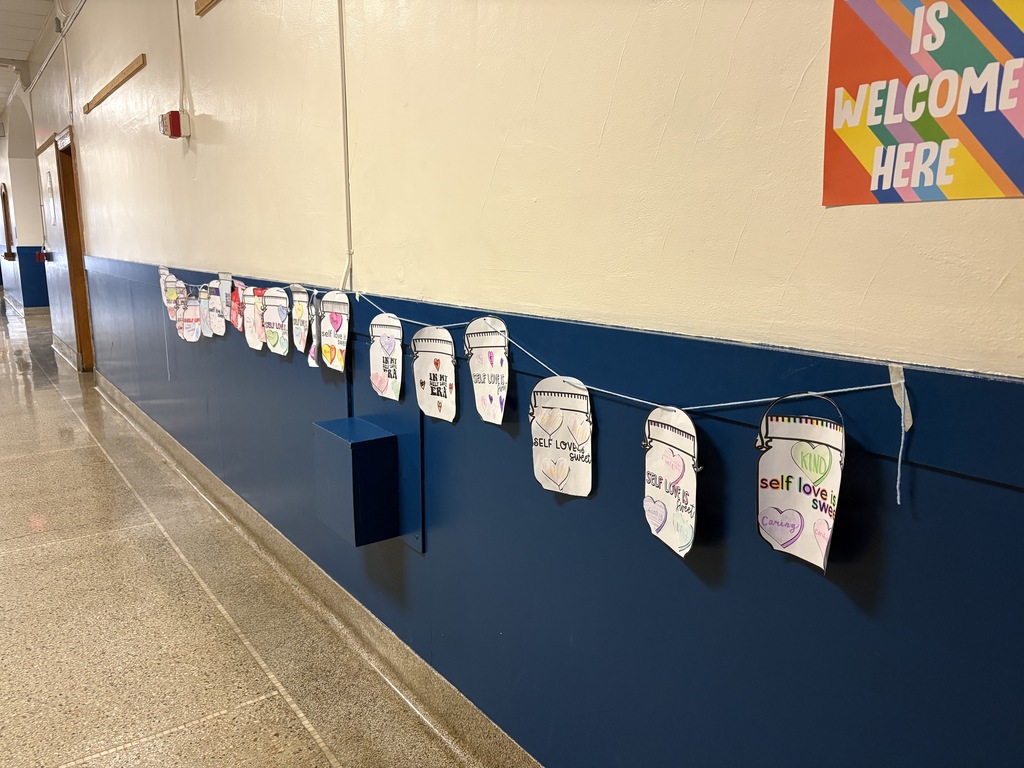 Self Love Is...jar notes hanging on a wall