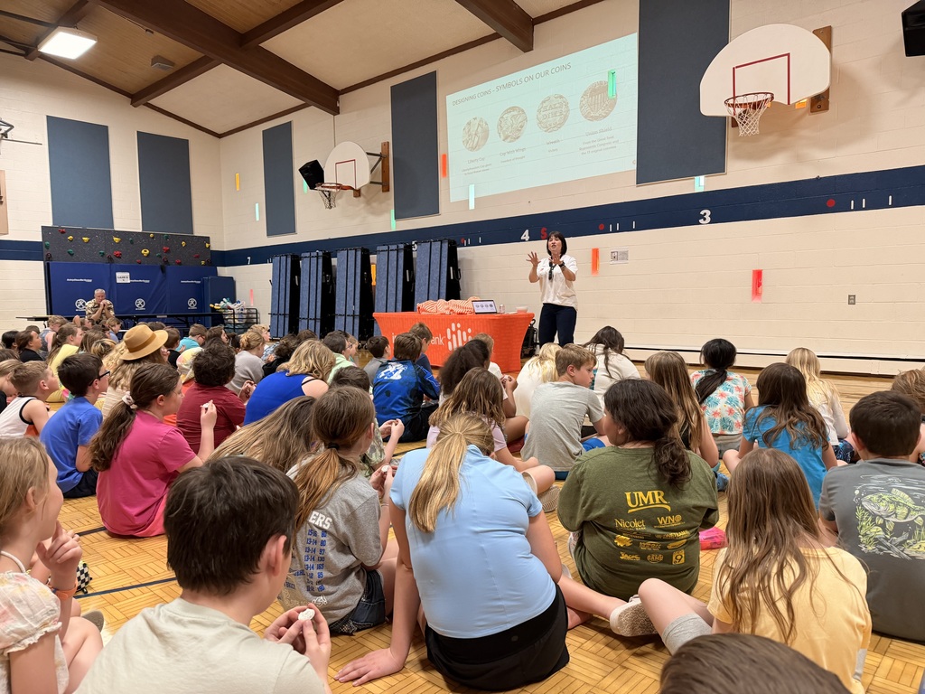 Susan Ryman presenting to students seated on floor