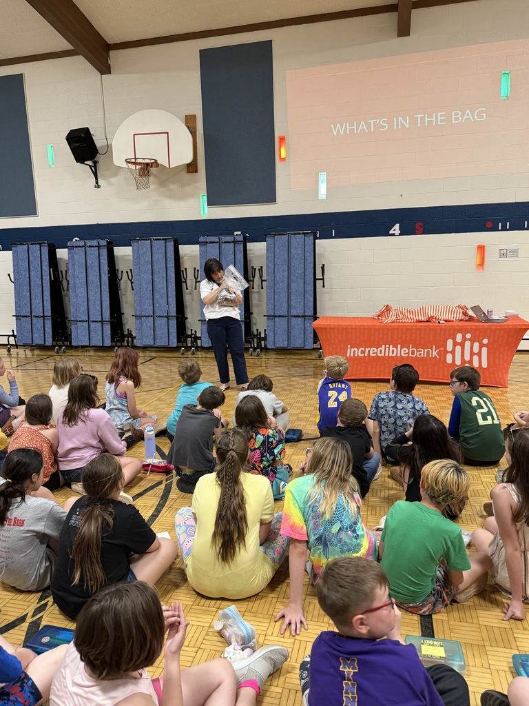 Susan Ryman presenting to students seated on floor