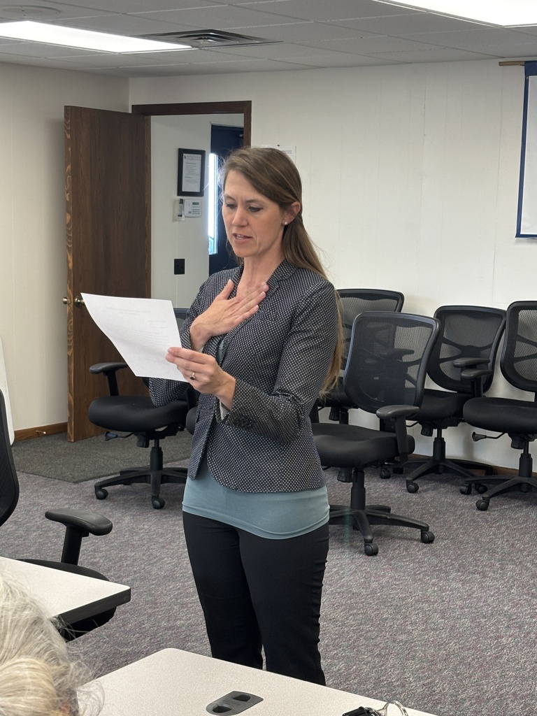 A woman taking an oath of office.